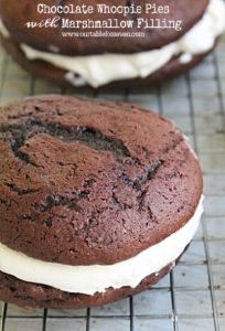 Chocolate Whoopie pies with marshmallow filling. An easy to bake recipe that is made with fudge cake mix.