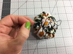 making the knotted bun for a turban beanie