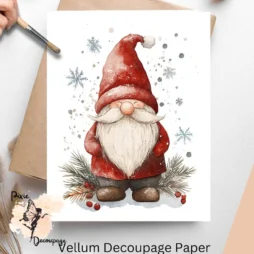 Image of a gnome dressed in red with snowflakes around it.