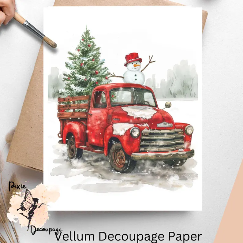 Image of a red truck with greenery and a snowman.